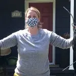 close up of woman holding coil of wires we removed from her home