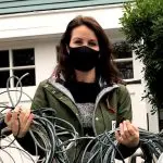 woman holding telecom wires Wire Free Sky removed from her home