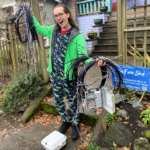photo of man holding up all the telecom wire he just had removed from his home