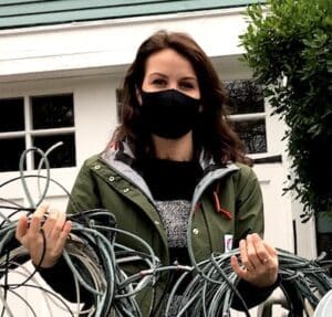 woman holding telecom wires Wire Free Sky removed from her home